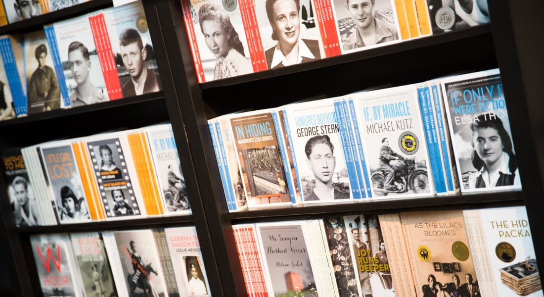 A series of books on a shelf.