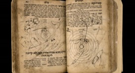 An open book with Hebrew text.